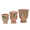 Image of Three terracotta antique urns with decorative patterns on a white background