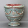Image of Decorative ceramic vase with intricate designs on a gray background