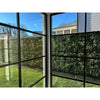 Image of View out a window towards the Artificial Vertical Garden of Eden Installed in the Garden on a fence