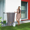 Image of Woman standing next to a Lanzarote rain barrel outside a modern house

