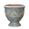 Image of Decorative ceramic planter with floral patterns on a white background