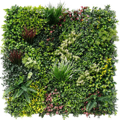 Artificial evergreen rainforest green wall panel with various types of plants on a white background