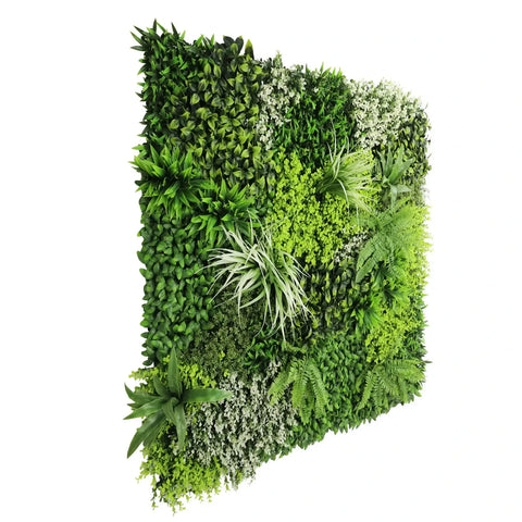 side view of artificial forest floor green wall panel with various green plants on a white background