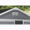 Image of Roof with a vent and gray covering, greenery in the background