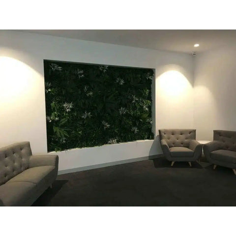 Artificial Green Forest Vertical Garden Panel Installed Indoors with a couch and 2 chairs on carpet