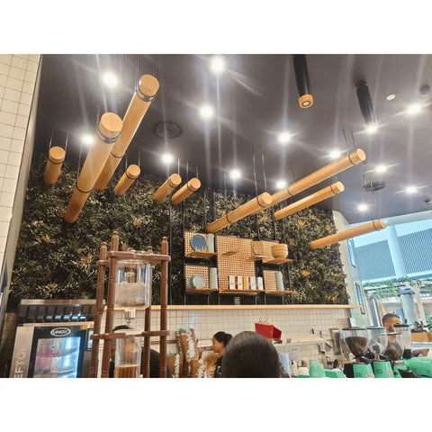 Artificial Green Forest Vertical Garden Panel Installed in a Coffee Shop behind the staff serving area