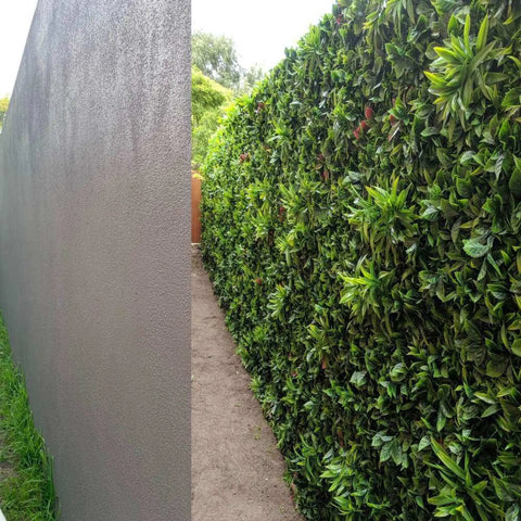 Before anda after view of the Artificial Green Meadows 1m x 1m Plant Wall Panel UV Stabilised installed on a concrete wall