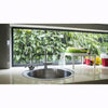 Image of Modern kitchen sink with a view of greenery wall outside