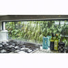 Image of Modern kitchen with gas stove and window view of greenery