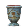 Image of Decorative ceramic vase with blue glaze and brown accents on a white background