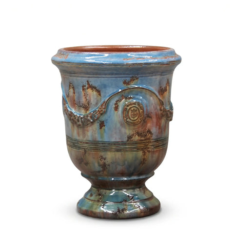 Ceramic vase with blue and brown glaze on a white background