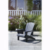 Image of Graphite Adirondack chair on a patio with plants and flowers in the background
