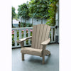 Image of Beige Adirondack chair on a porch with greenery in the background