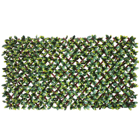 An artificial laurel leaf trellis screen showing a dense foliage pattern in green.