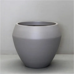Sierra Lightweight Calix Pot Planter against wall