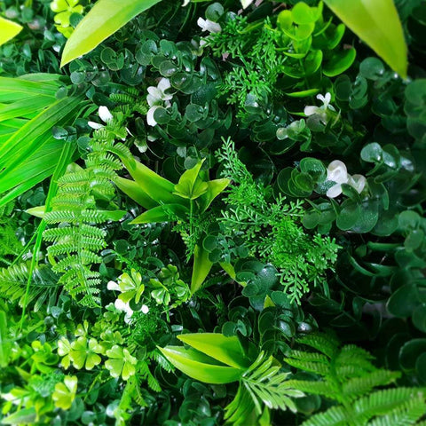 zoomed in view of some white flowers and ferns on the Wild Tropics Artificial Vertical Garden Panel