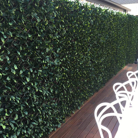 Artificial Jasmine Hedge Extendable Trellis installed on patio fence