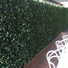 Image of Artificial Jasmine Hedge Extendable Trellis installed on patio fence