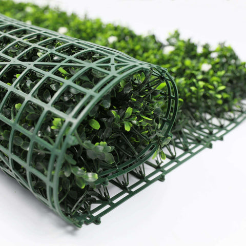 artificial flowering buxus panel rolled up showing its flexibility