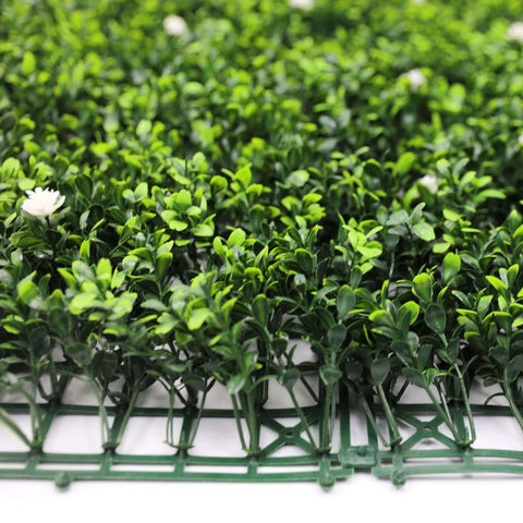 close up detail showing the leaves of the artificial flowering buxus hedge panel